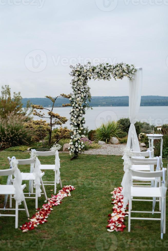 wedding ceremony in the woods among the trees on the green track photo