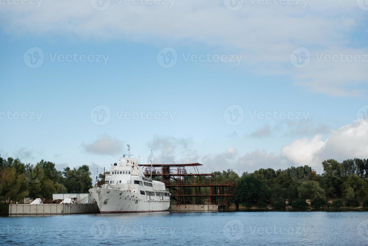 an old white ship with traces of rust photo