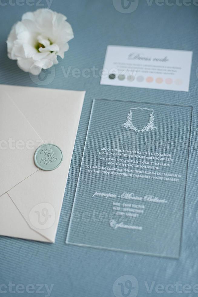 wedding invitation in a gray envelope on a table photo