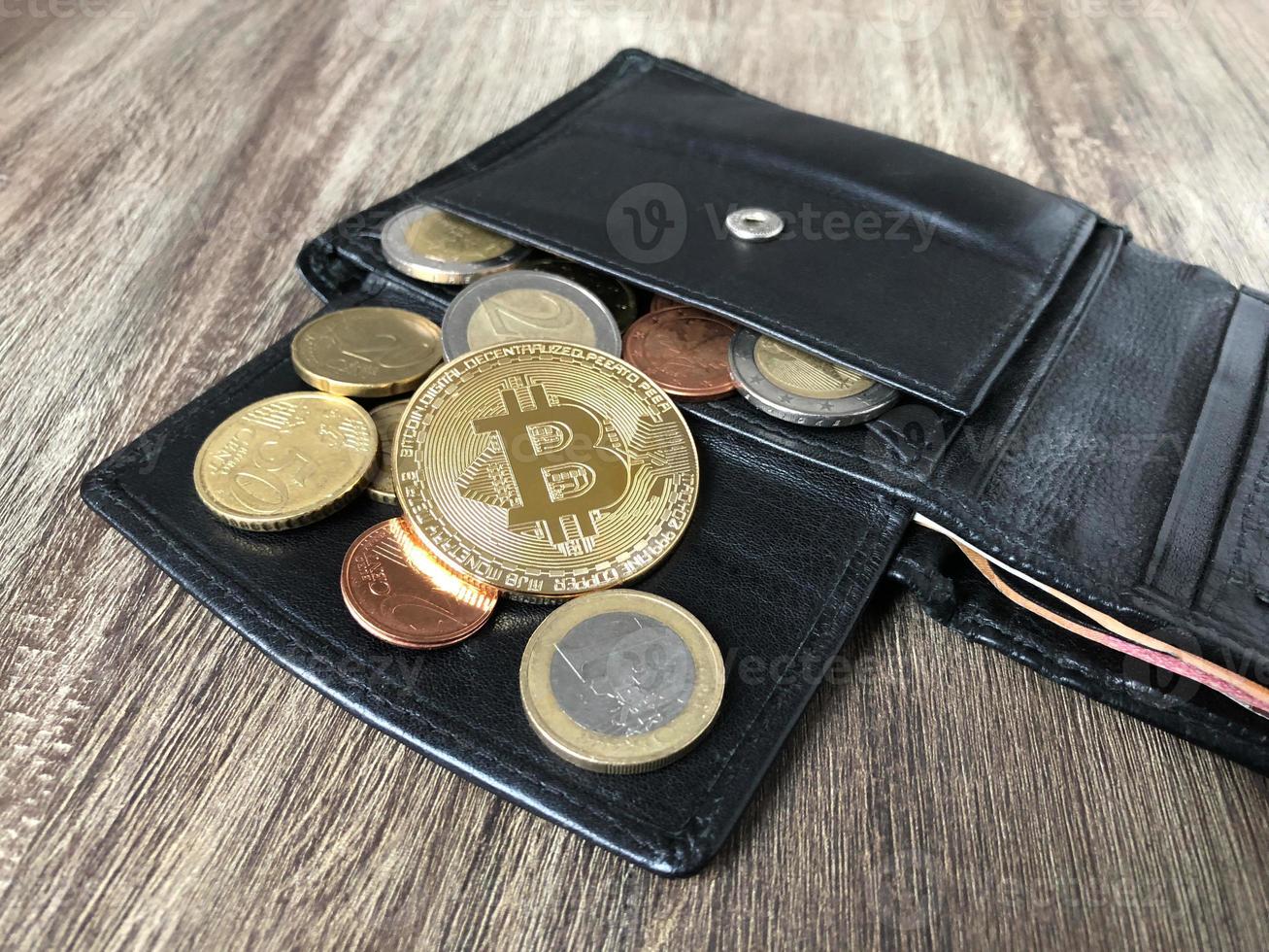 wallet with bitcoin euro and cent coins photo