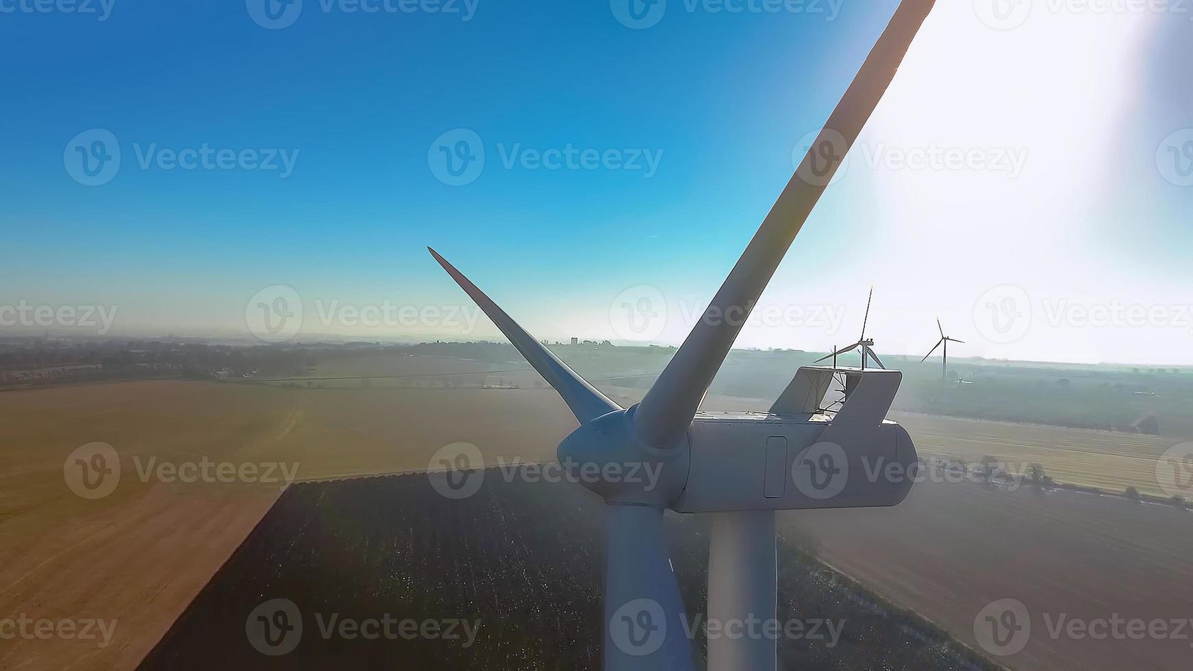 The wind turbine power working, blue sky, energy power concept photo