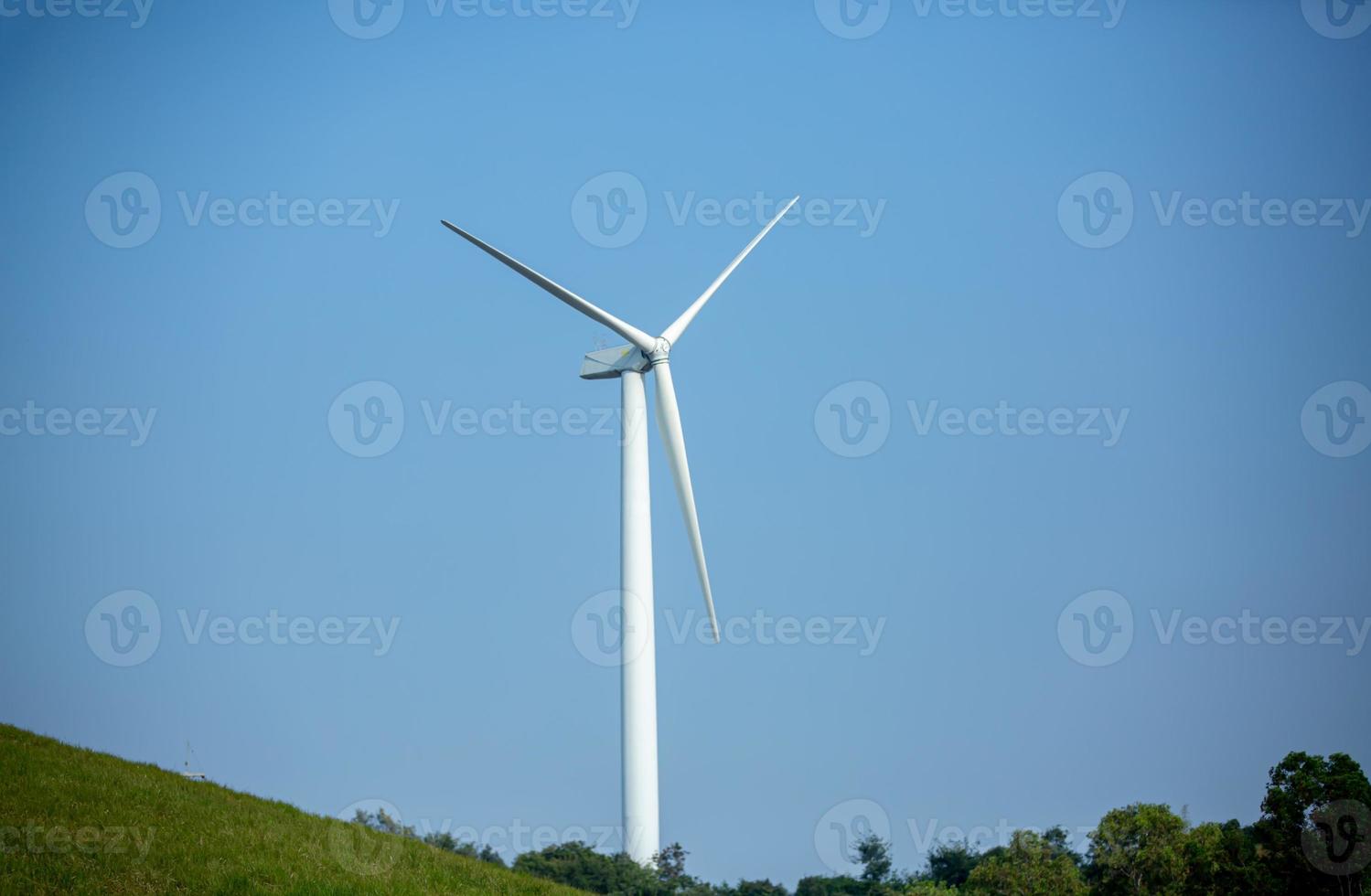 The wind turbine power working, blue sky, energy power concept photo