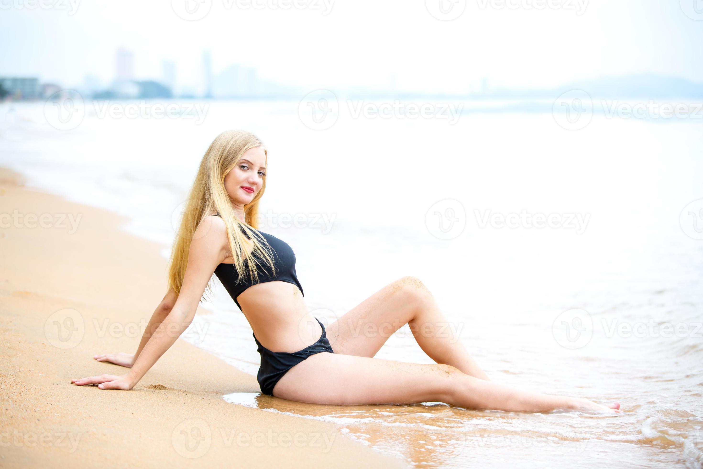 Beautiful blonde woman on black bikini