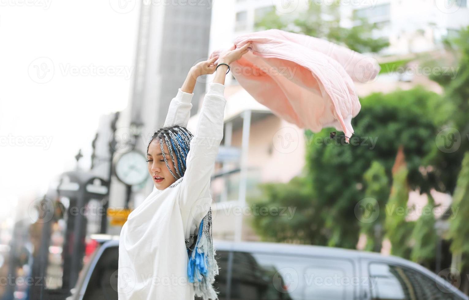 Young pretty girl walk on the street. photo