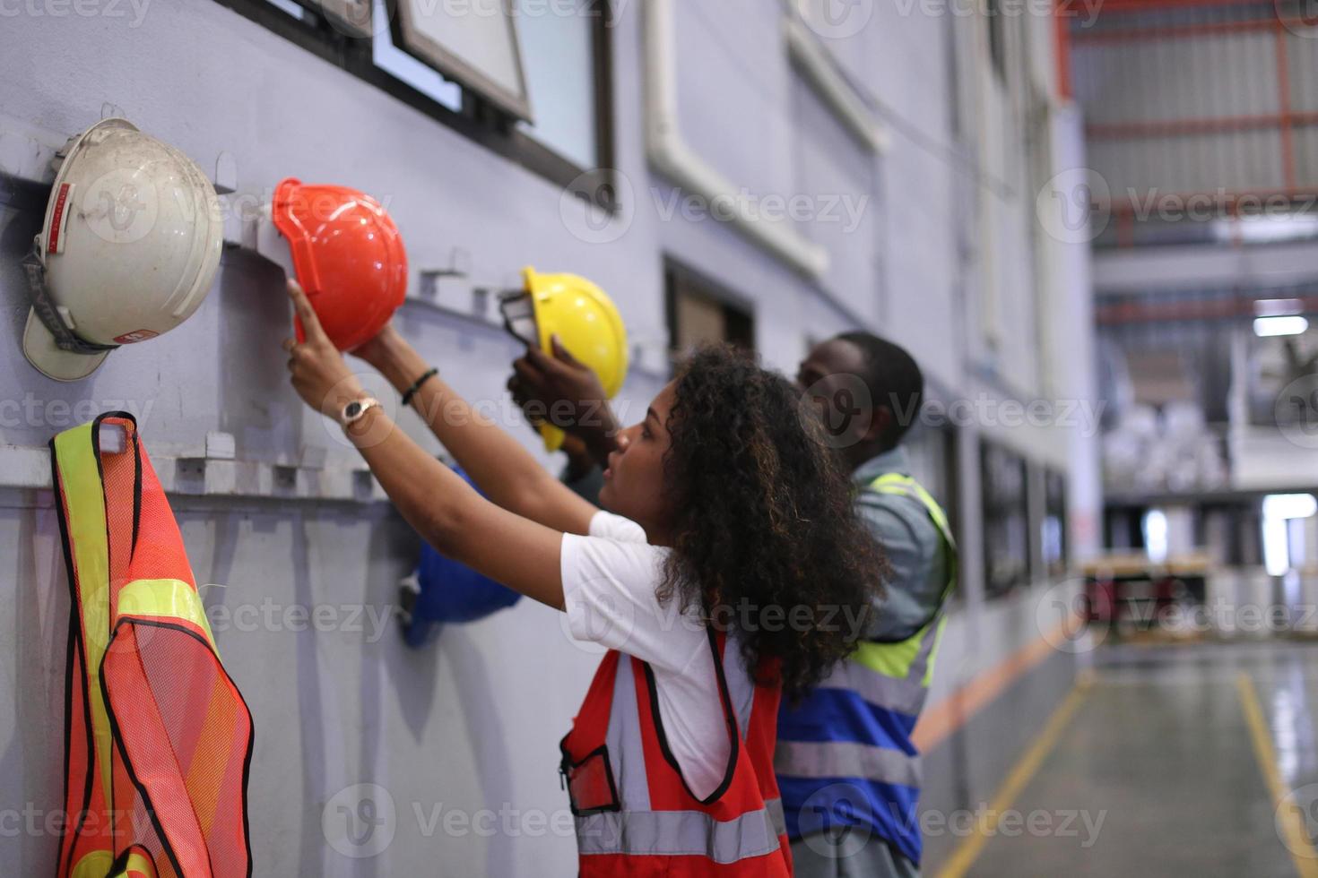 Industry worker Foreman or worker work at factory site check up machine or products in site. Engineer or Technician checking Material or Machine on Plant. Industrial and Factory. photo