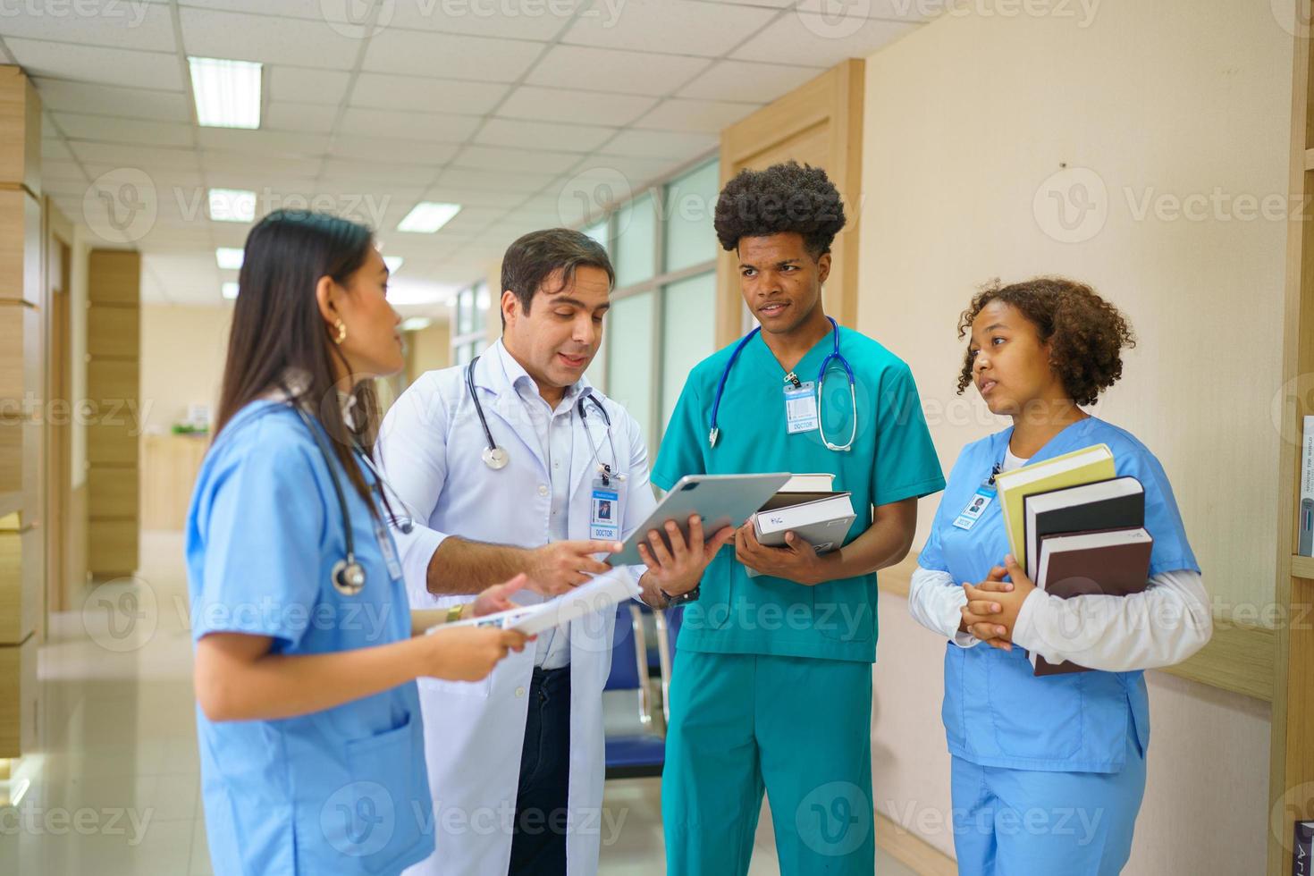 International doctor team. Hospital medical staff. Mixed race Asian and Caucasian doctor and nurse meeting. Clinic and stethoscope. photo