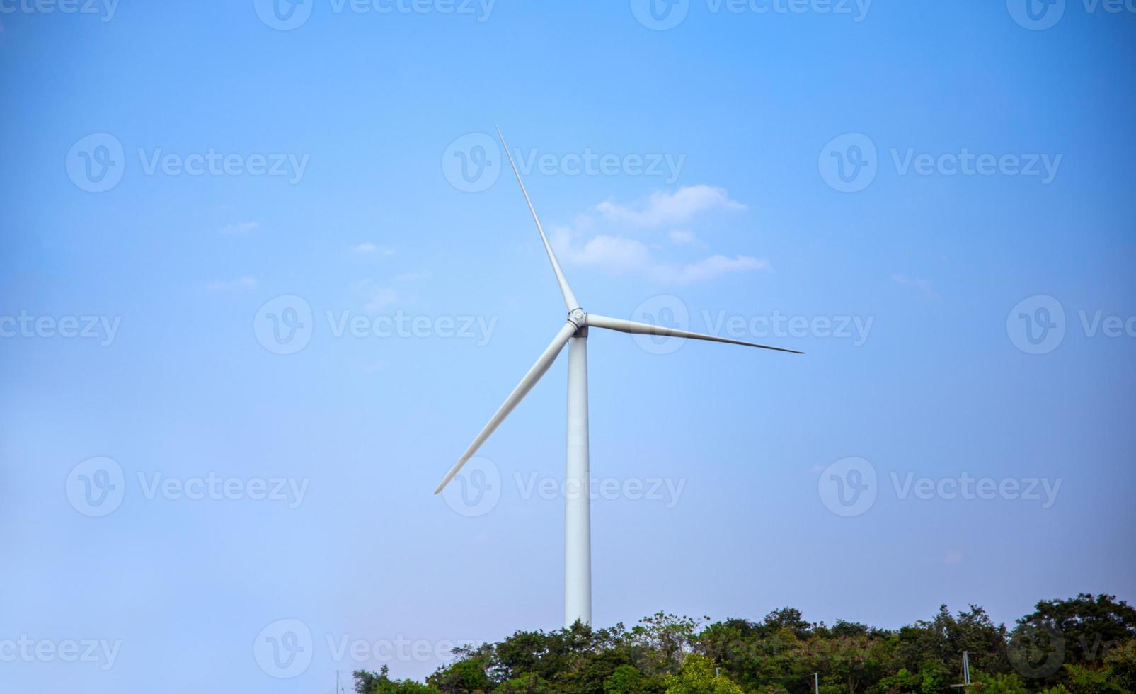 The wind turbine power working, blue sky, energy power concept photo