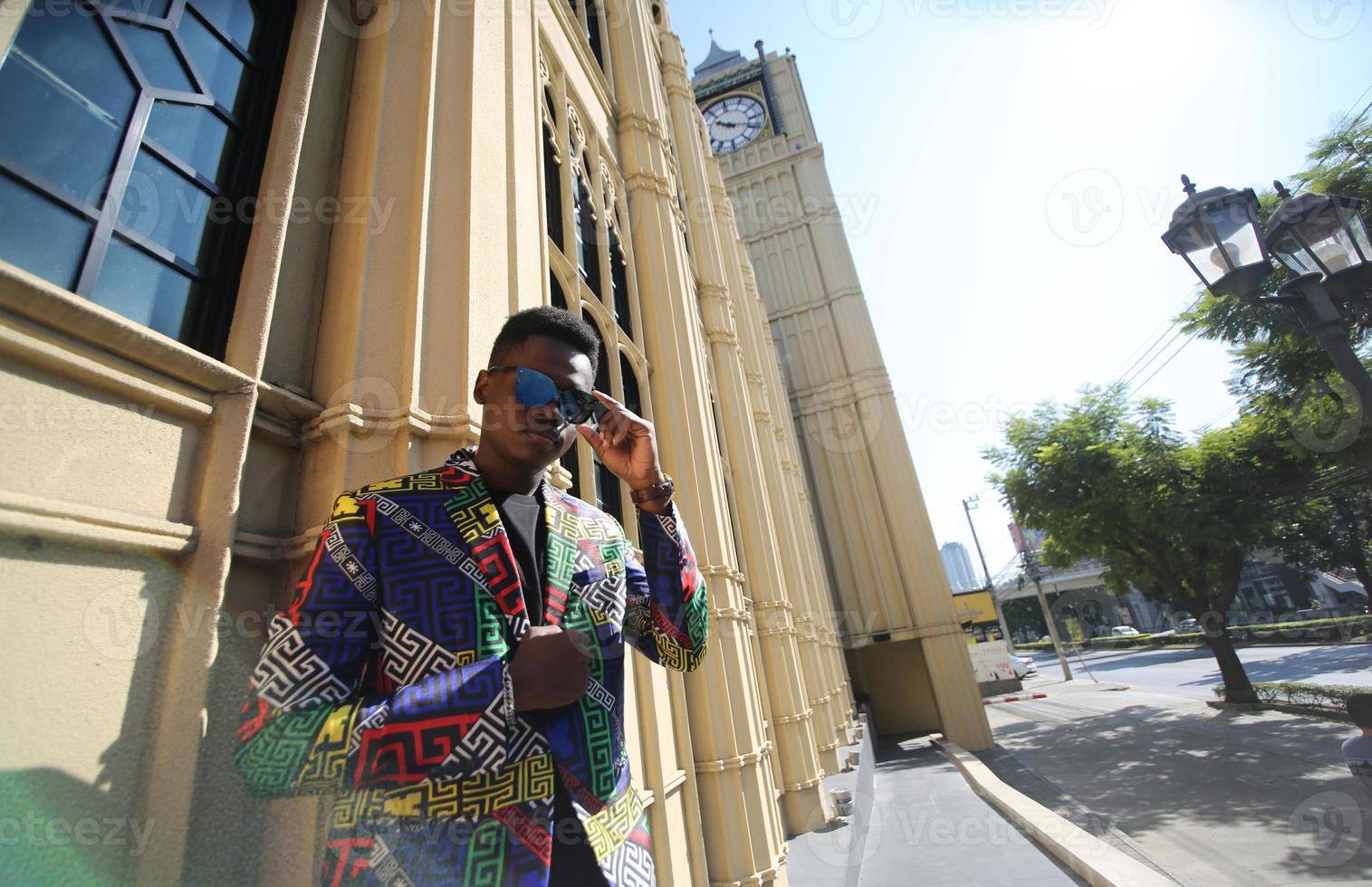 Afro American man having fun walking in city center - Happy young guy enjoying time a sunset outdoor - Millennial generation lifestyle and positive people attitude concept photo