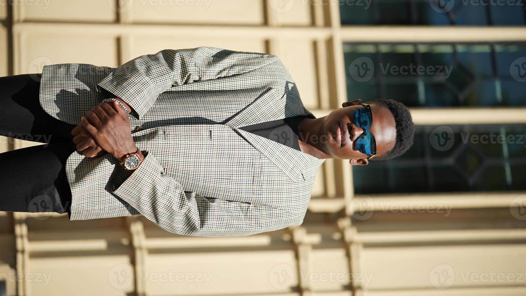 Afro American man having fun walking in city center - Happy young guy enjoying time a sunset outdoor - Millennial generation lifestyle and positive people attitude concept photo