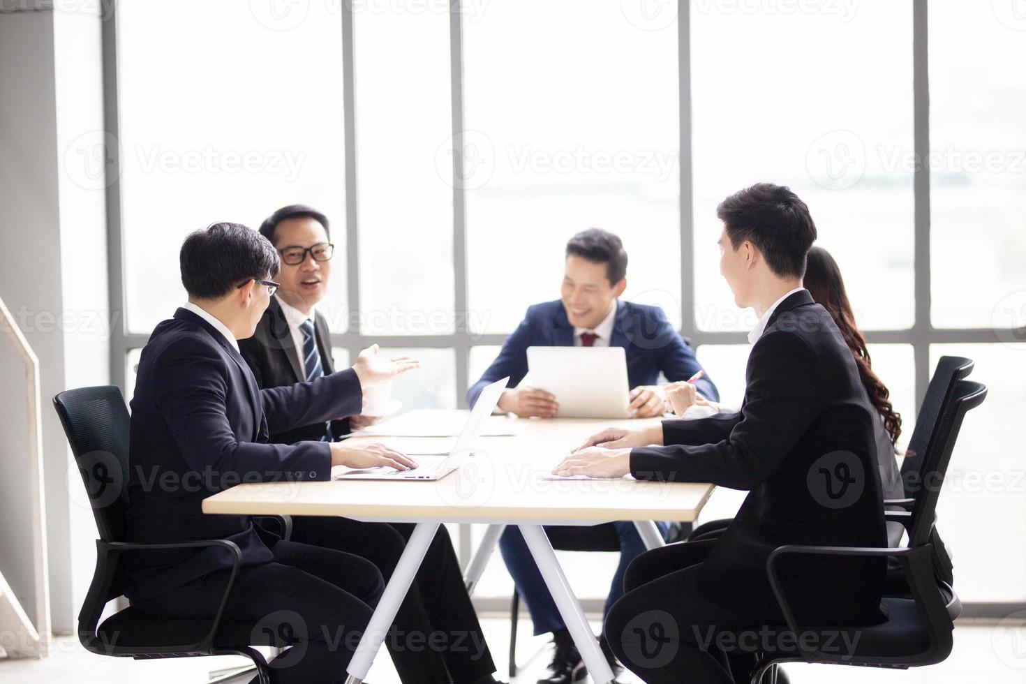 Multiethnic diverse group of business coworkers in team meeting discussion photo