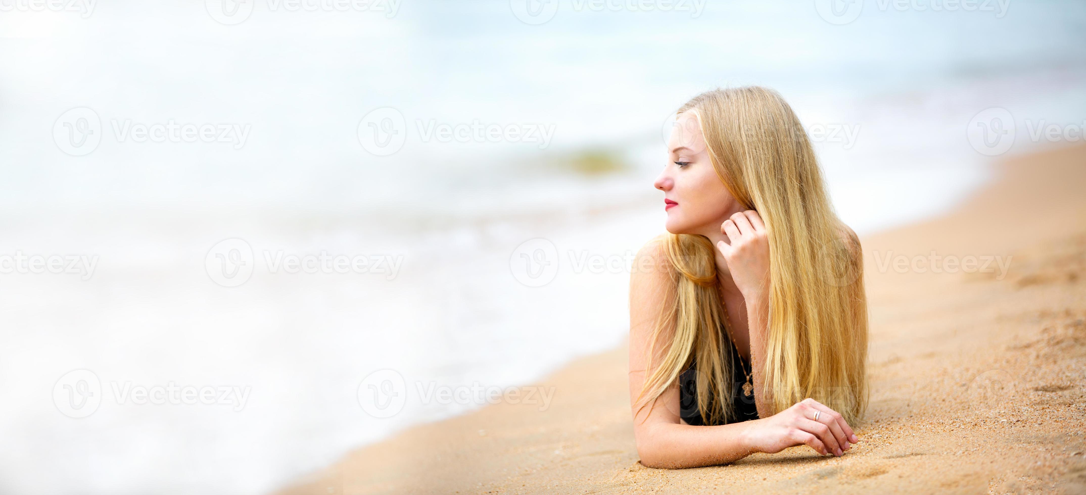 Beautiful blonde woman on black bikini