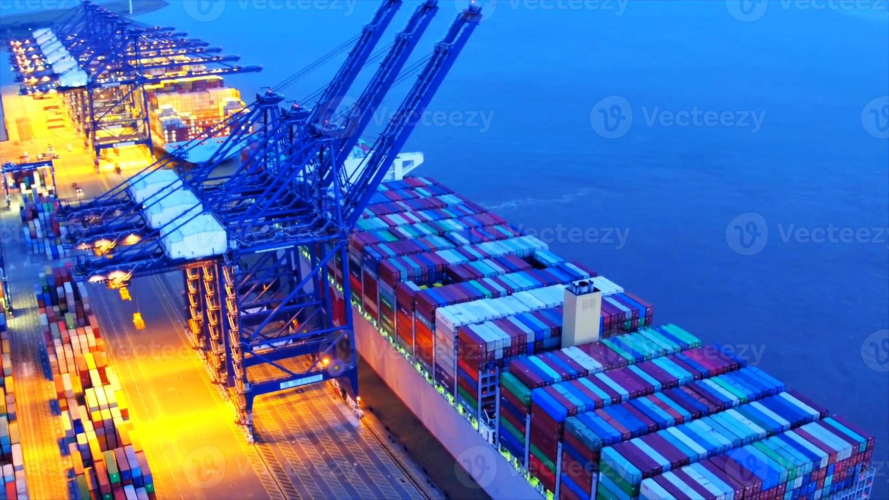 Container loading in a Cargo freight ship with industrial crane. Container ship in import and export business logistic company. Industry and Transportation concept. photo