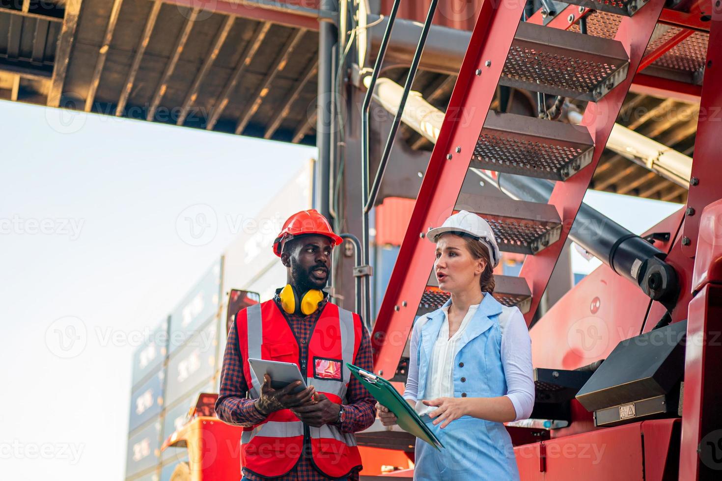 Foreman checking containers in the terminal, at import and export business logistic company. photo