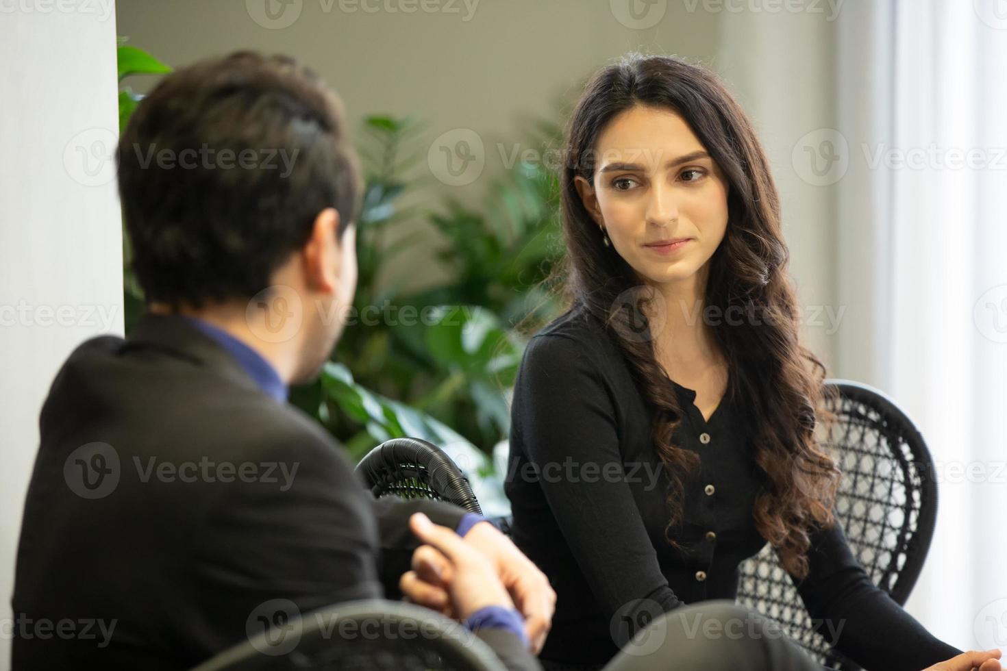 Two business people collaborating in office or Multiethnic business people in meeting. photo