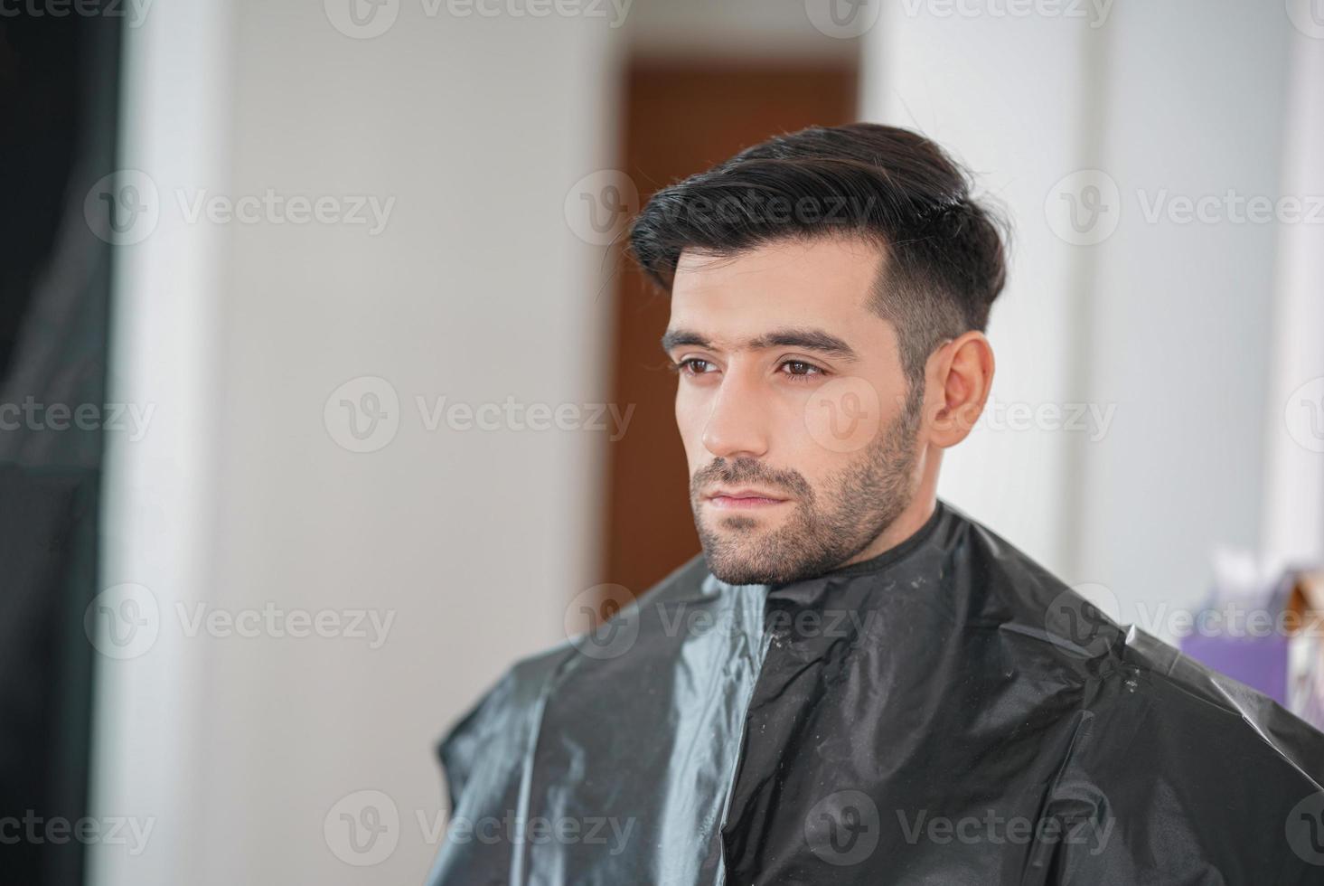 portrait of handsome man was make up by artist on his face. photo