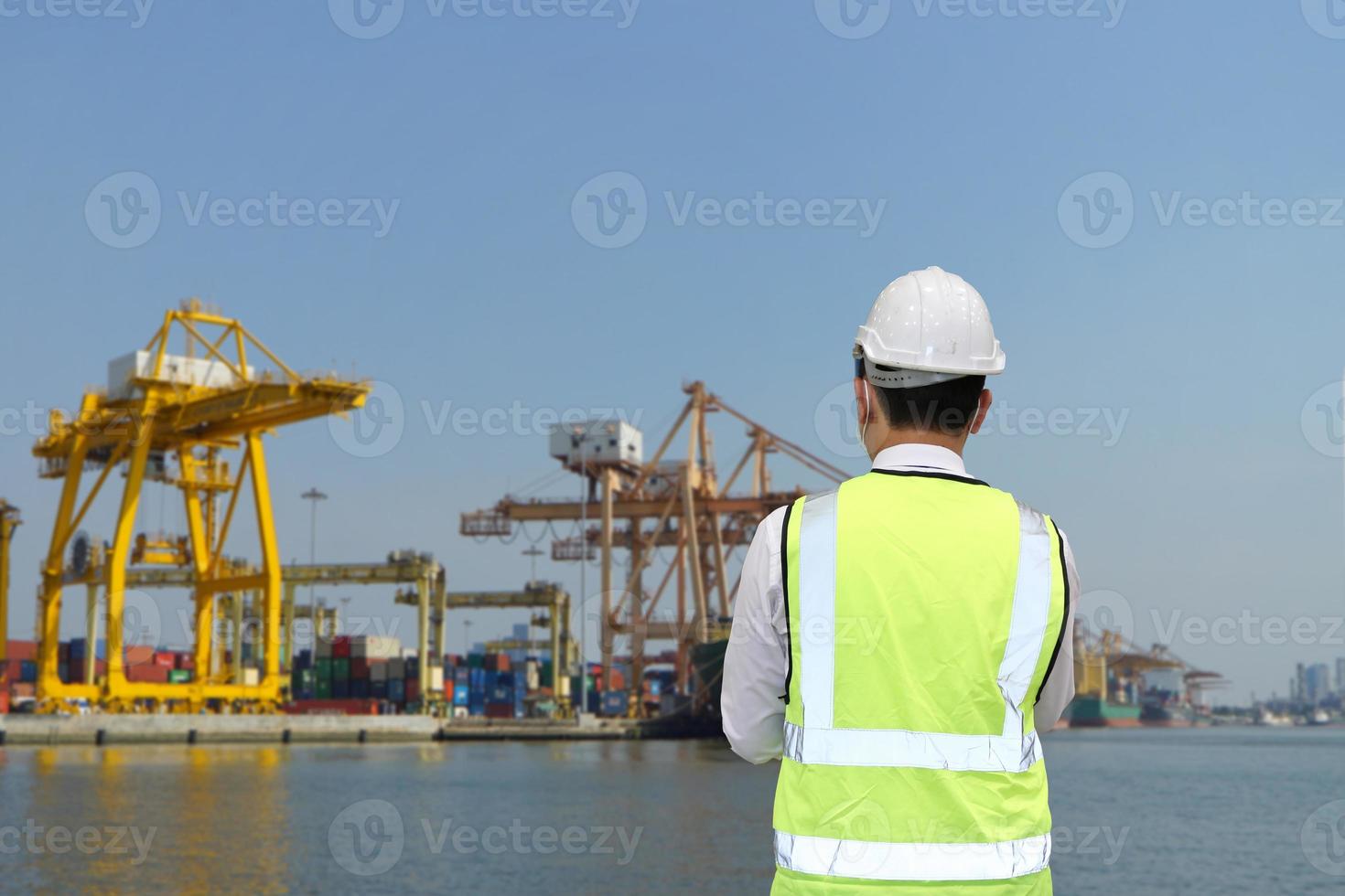 Container loading in a Cargo freight ship with industrial crane. Container ship in import and export business logistic company. Industry and Transportation concept. photo