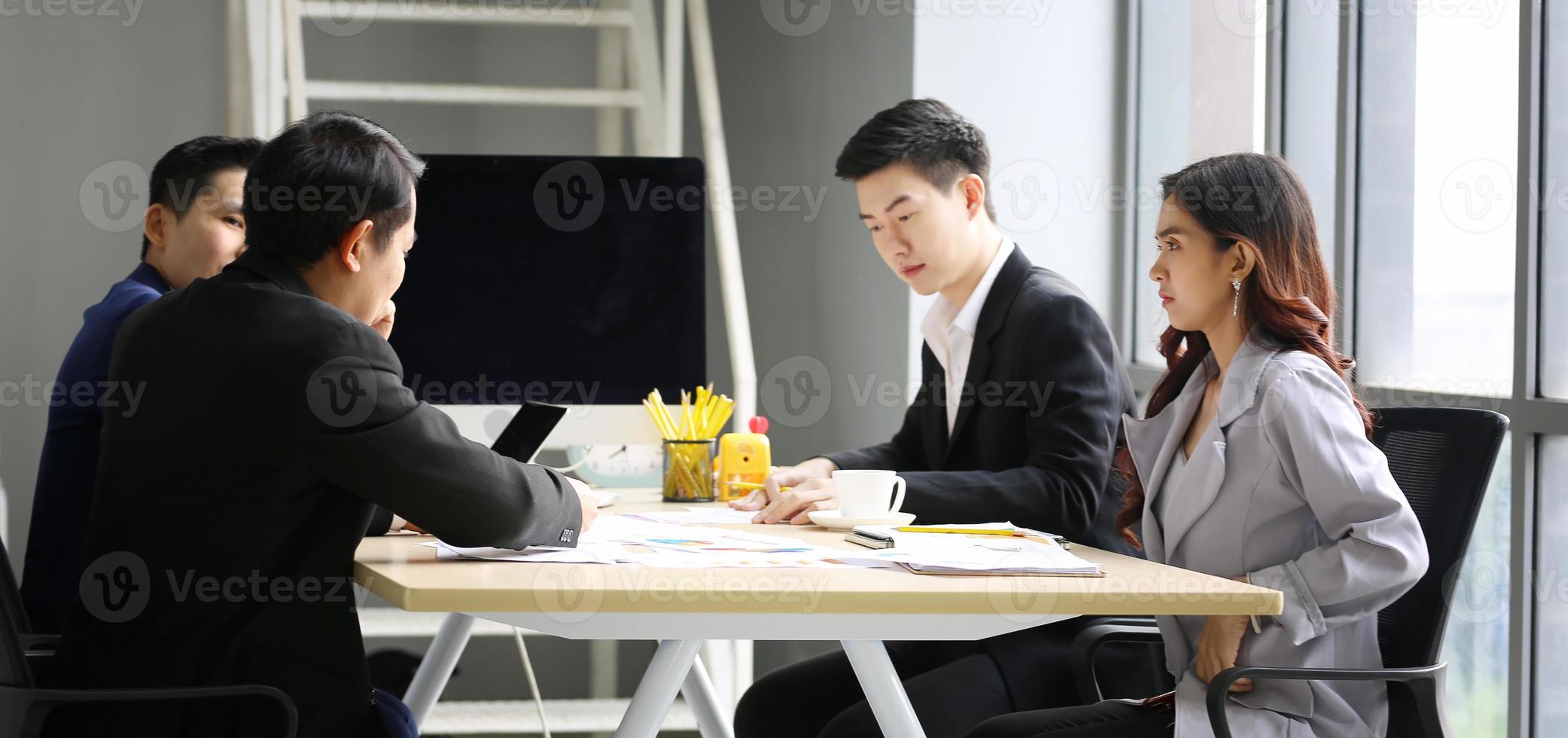 Multiethnic diverse group of business coworkers in team meeting discussion photo