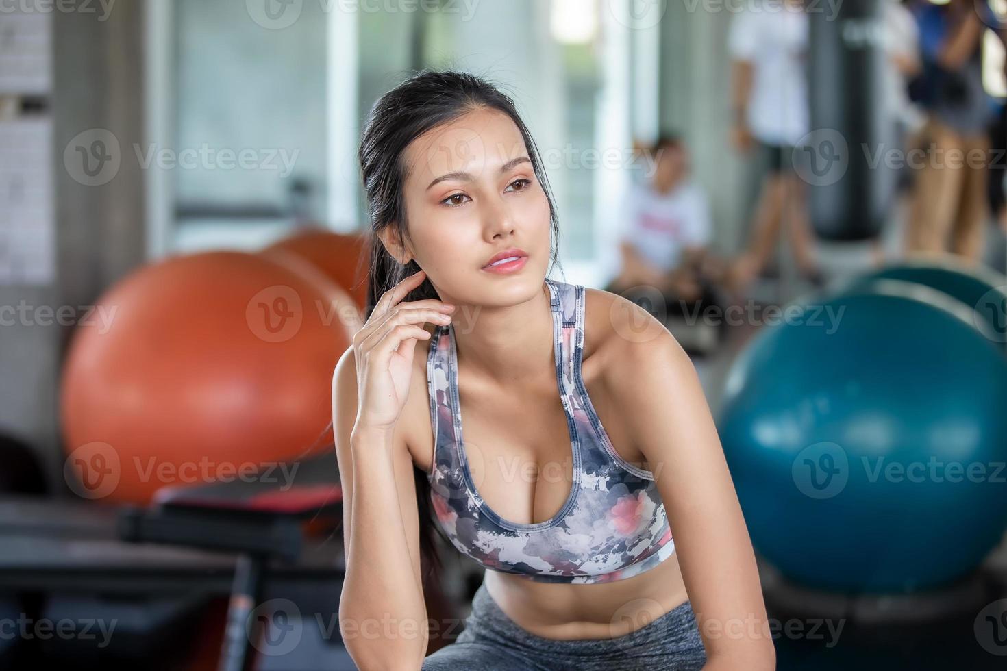 young asian woman workout and exercise at fitness gym. photo