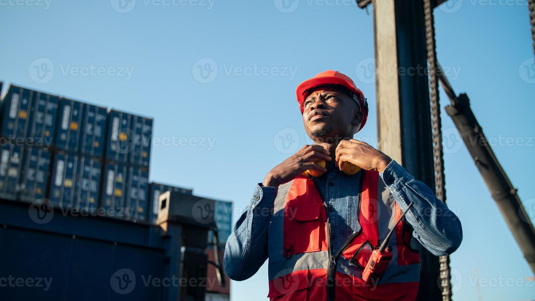 foreman checking containers in the terminal, at import and export business logistic company. photo