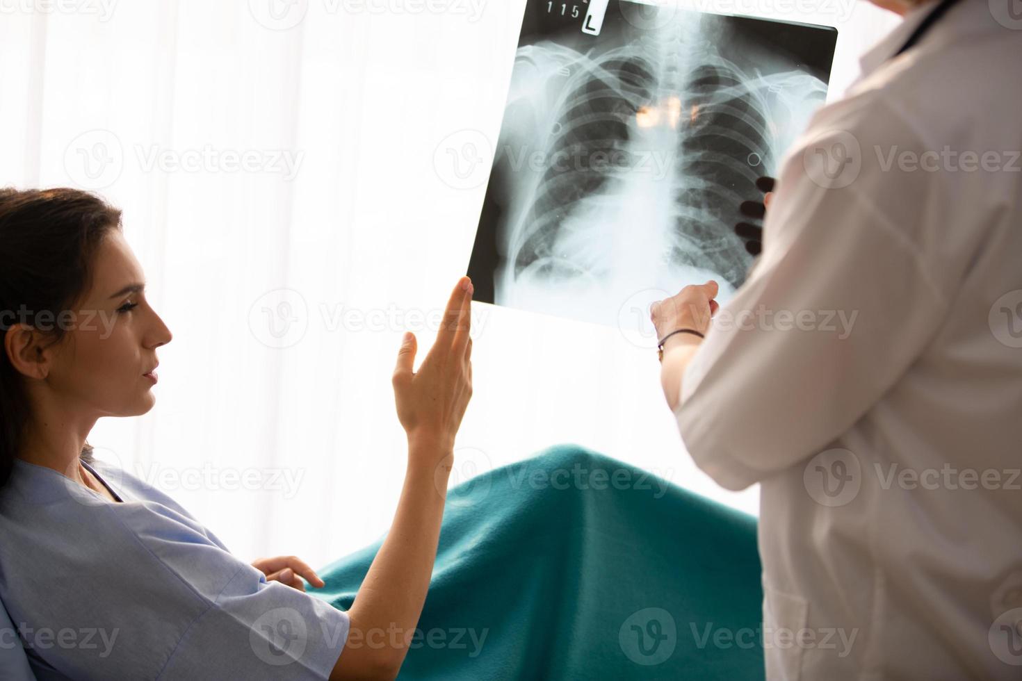 Doctor and patient in hospital photo