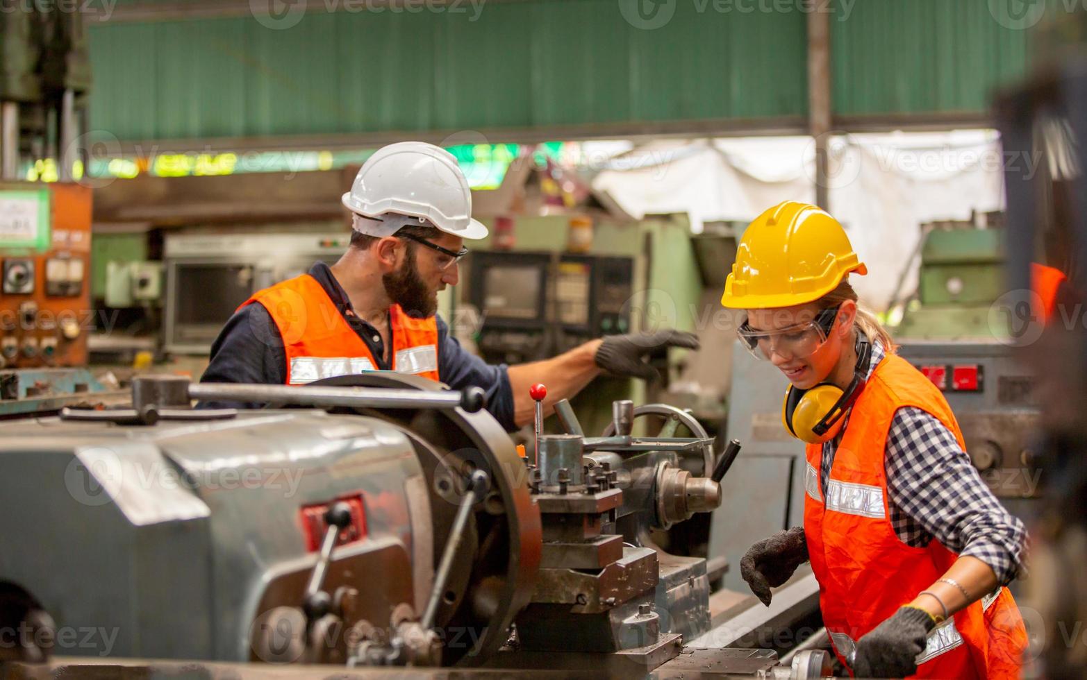 Foreman or worker work at factory site check up machine or products in site. Engineer or Technician checking Material or Machine on Plant. Industrial and Factory. photo