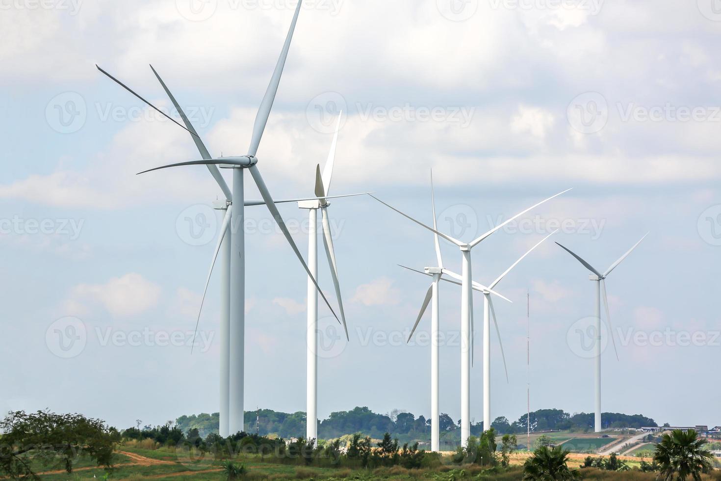 The wind turbine power working, blue sky, energy power concept photo