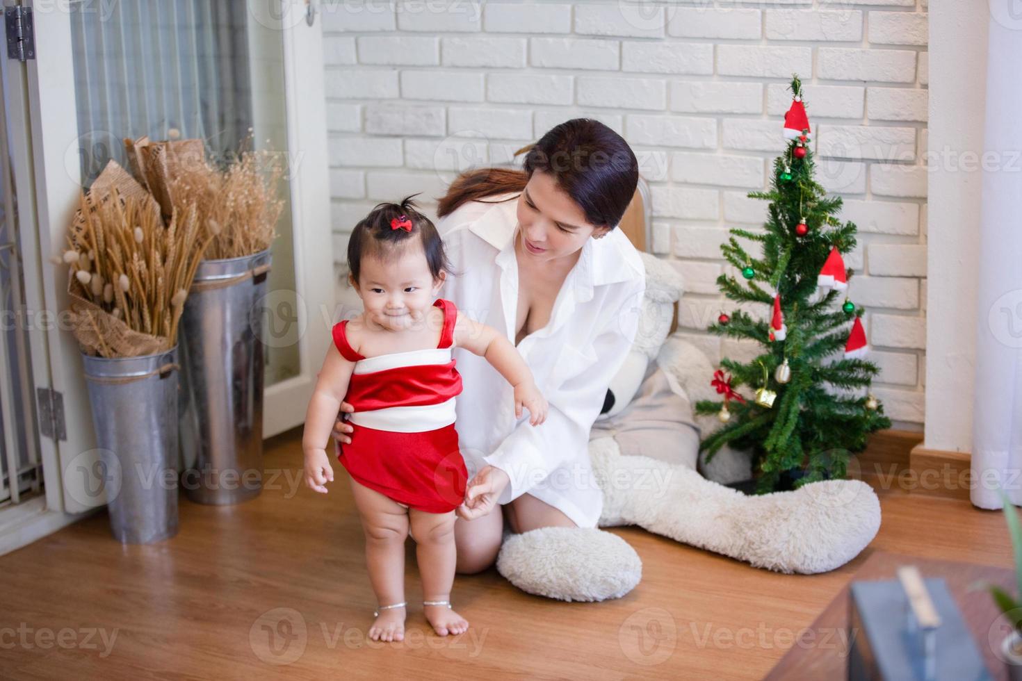 Happy family mom and daughter play at home. photo