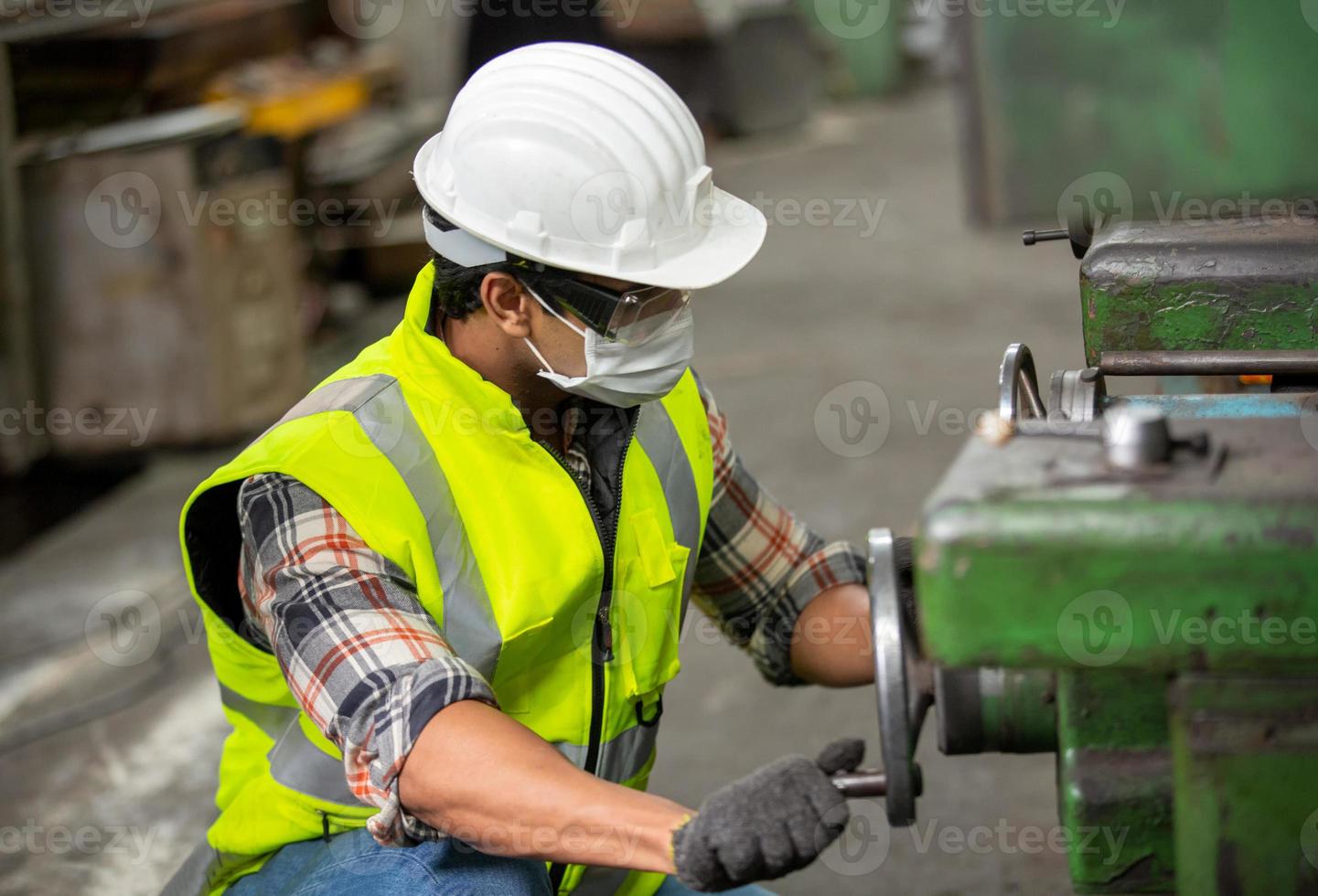 Worker work at factory site check up machine in products line or products in site. Engineer or Technician checking Material or Machine on Plant. Industrial and Factory. photo