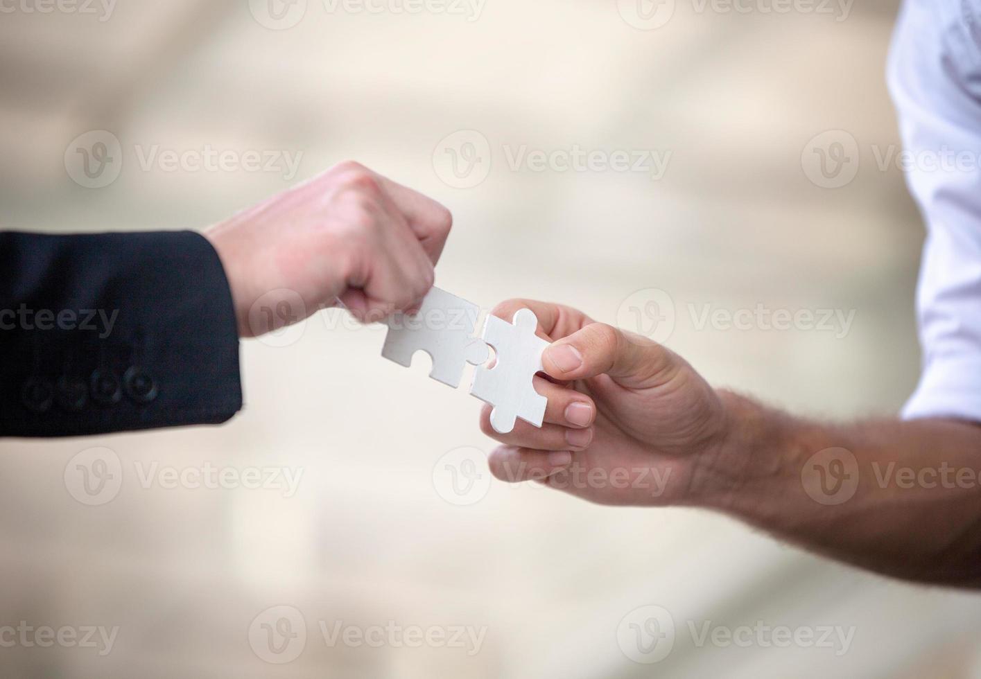 Business people shaking hands after successful negotiations photo