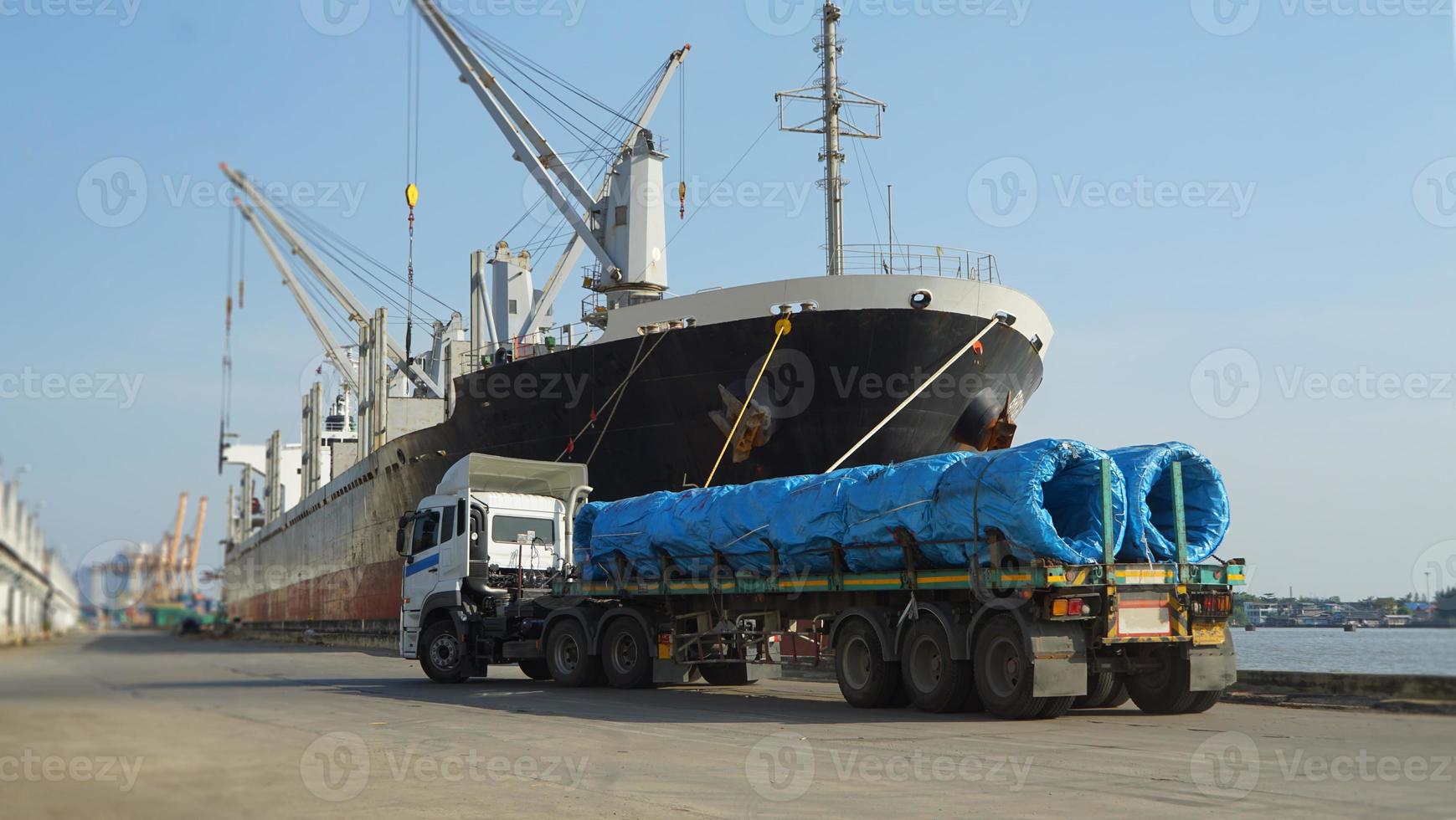 Container loading in a Cargo freight ship with industrial crane. Container ship in import and export business logistic company. Industry and Transportation concept. photo