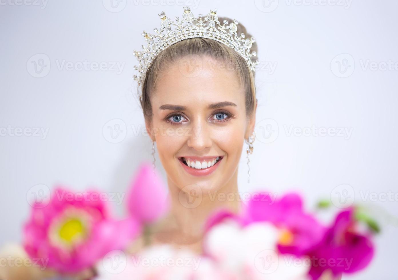 Portrait Of Smiling Young Woman Over white gray  Background photo