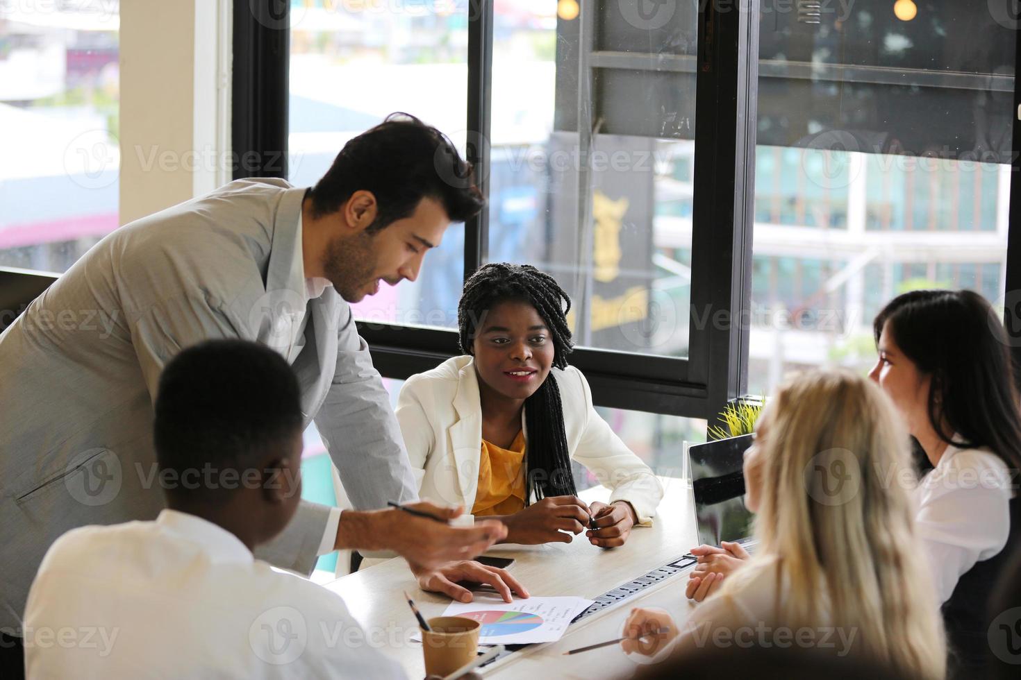 Group of diverse business people collaborating in office or Multiethnic business people in meeting. photo