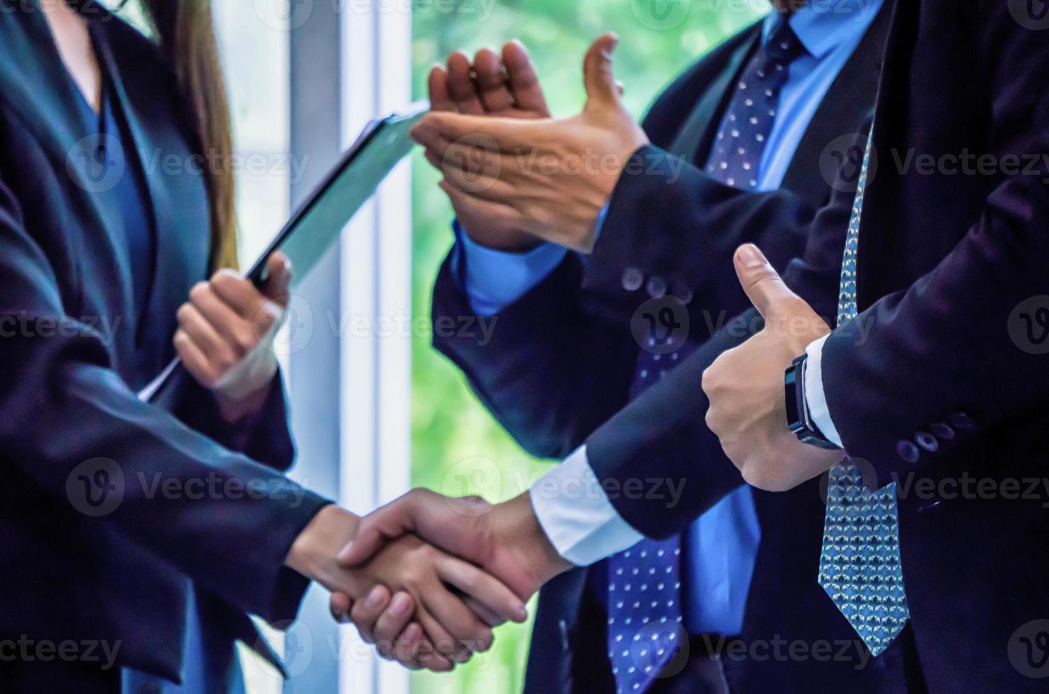 Businessman handshake for teamwork of business merger and acquisition,successful negotiate,hand shake,two businessman shake hand with partner to celebration partnership and business deal concept photo