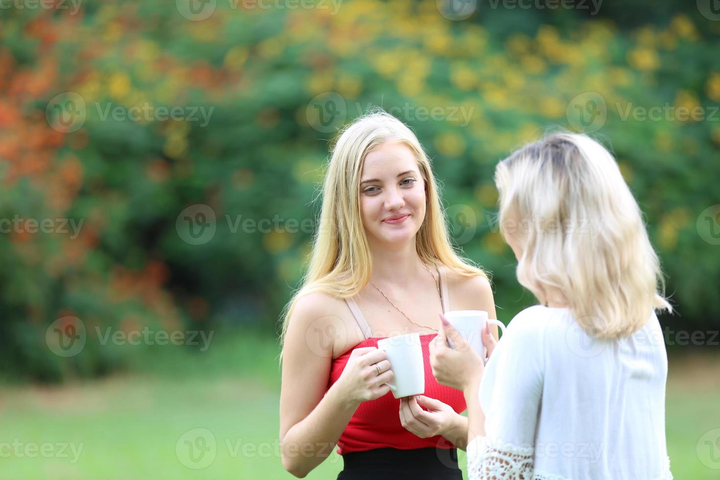 Portrait of two young friends outdoors. photo
