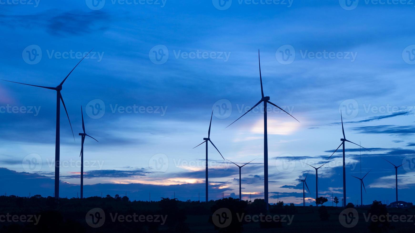 The wind turbine power working, blue sky, energy power concept photo