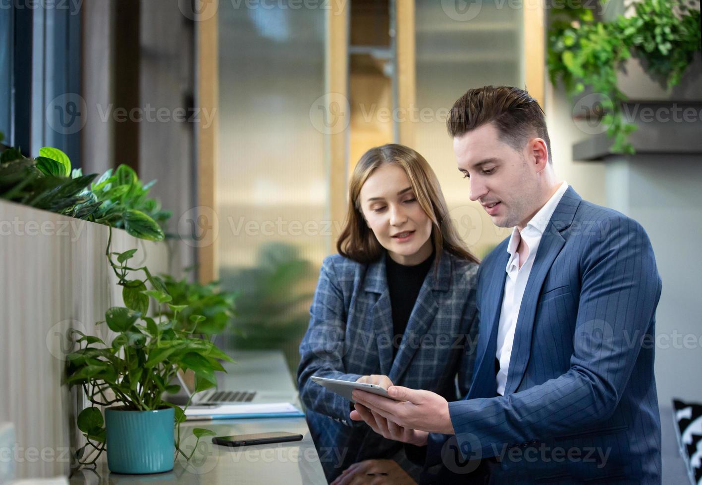 Two of business people discussing and collaborating in office or Multiethnic business people in meeting. photo