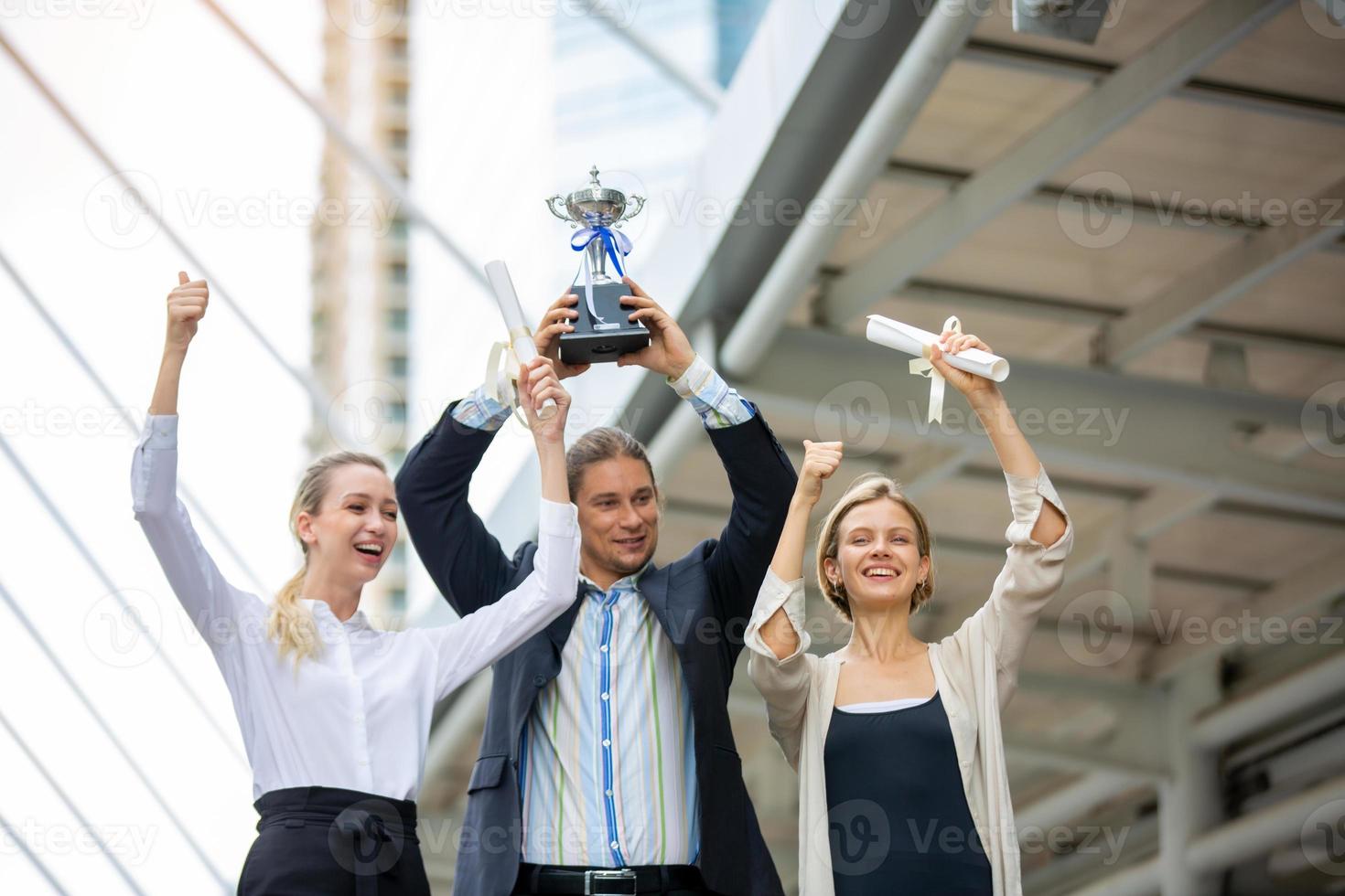 Successful business people standing together widen out showing strong relationship of worker community. A team of businessman and businesswoman expressing a strong group teamwork at the modern office. photo