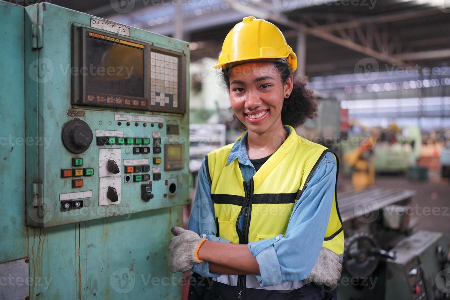 Female Maintenance Engineers is working in front of the automated CNC machinery repair on a maintenance checklist at the production line. photo
