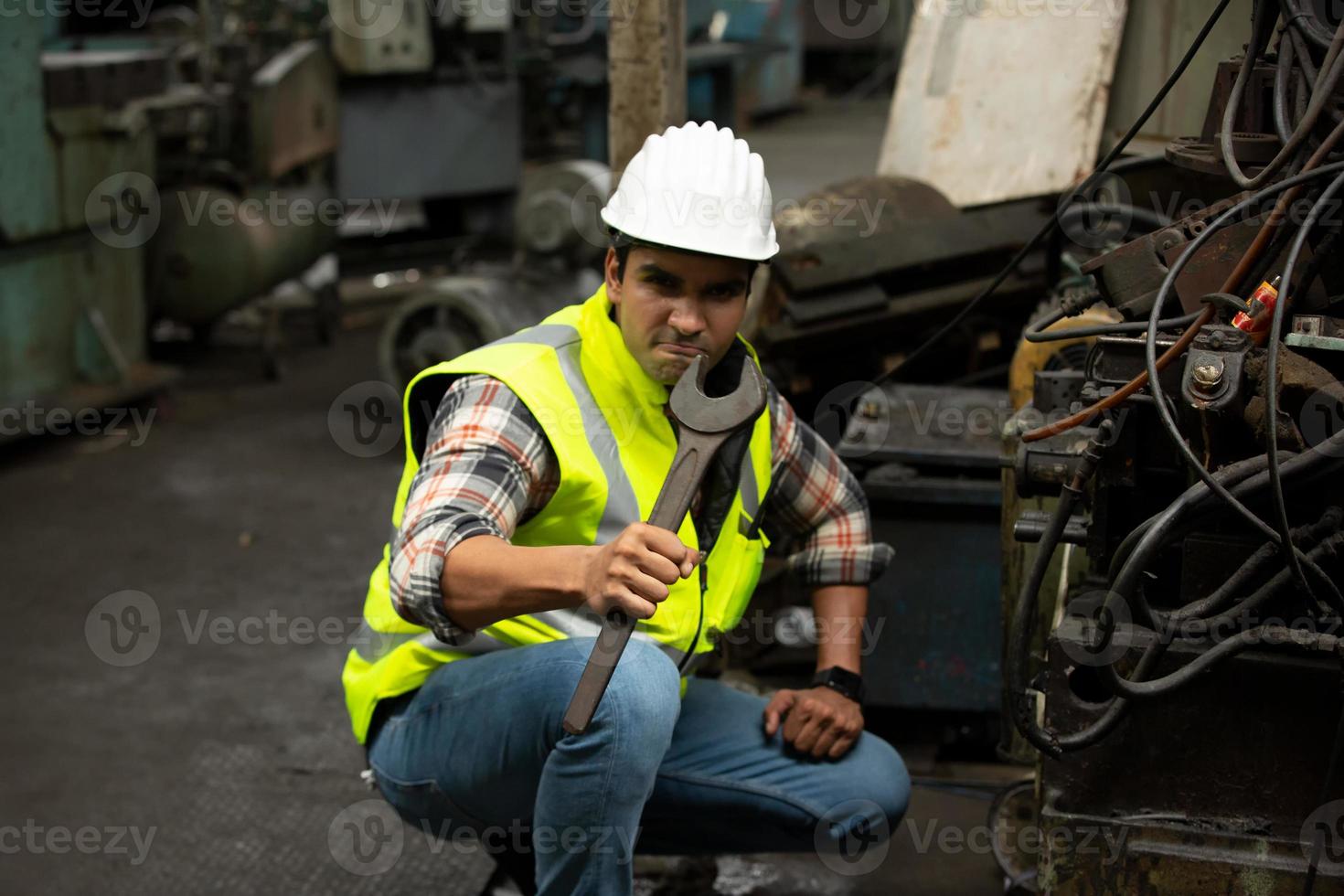 Foreman or worker work at factory site check up machine or products in site. Engineer or Technician checking Material or Machine on Plant. Industrial and Factory. photo