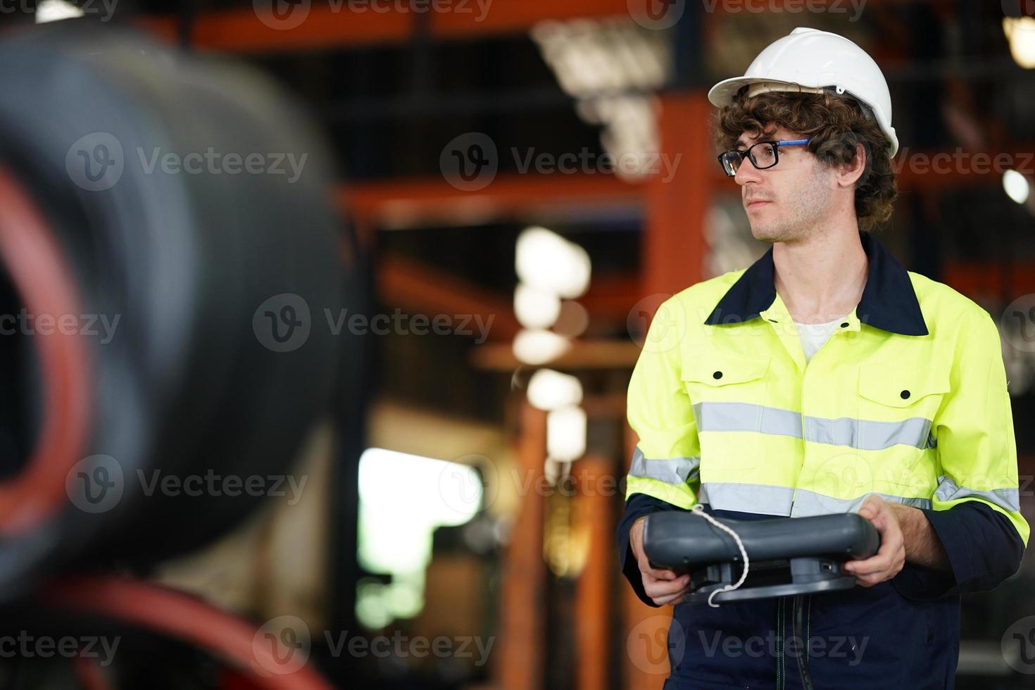 engineer checking control panel and teaching new Automatics robot arm and operating control machine in factory. photo