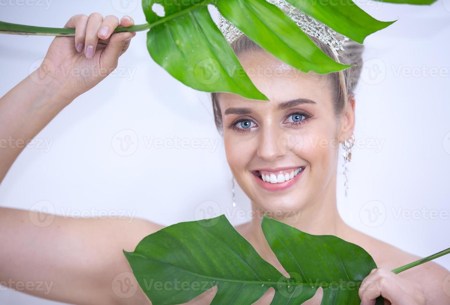 Portrait Of Smiling Young Woman Over white gray  Background photo