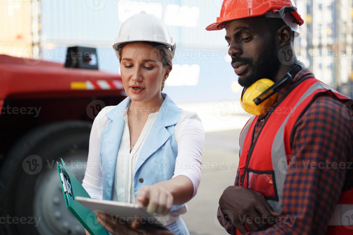 Foreman checking containers in the terminal, at import and export business logistic company. photo