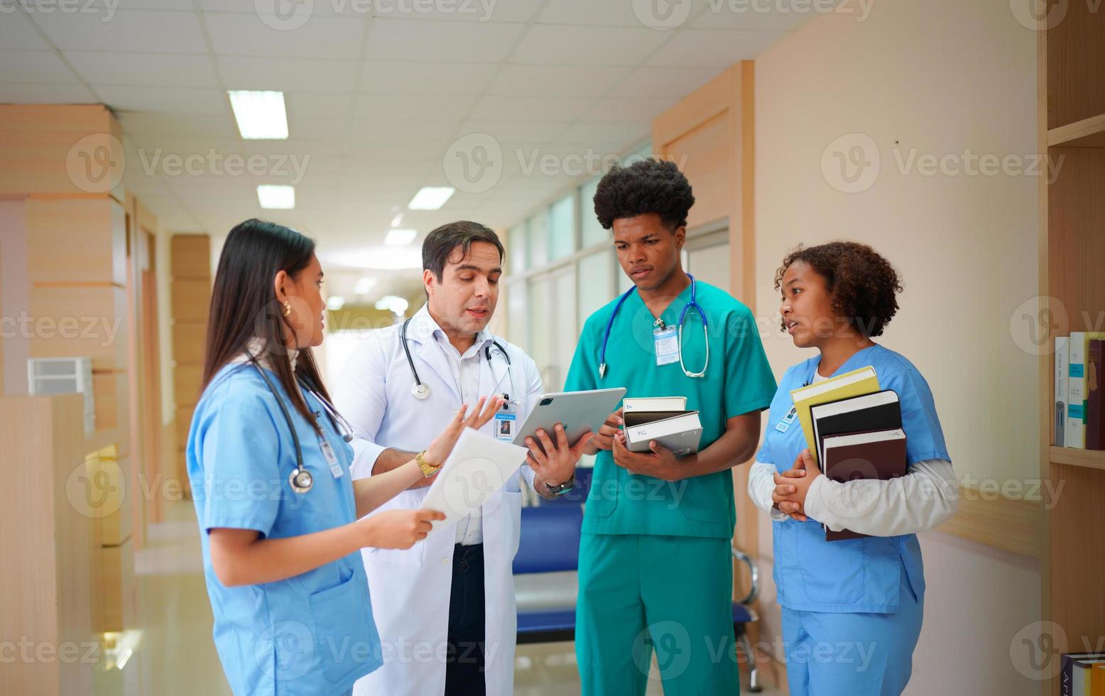 International doctor team. Hospital medical staff. Mixed race Asian and Caucasian doctor and nurse meeting. Clinic and stethoscope. photo