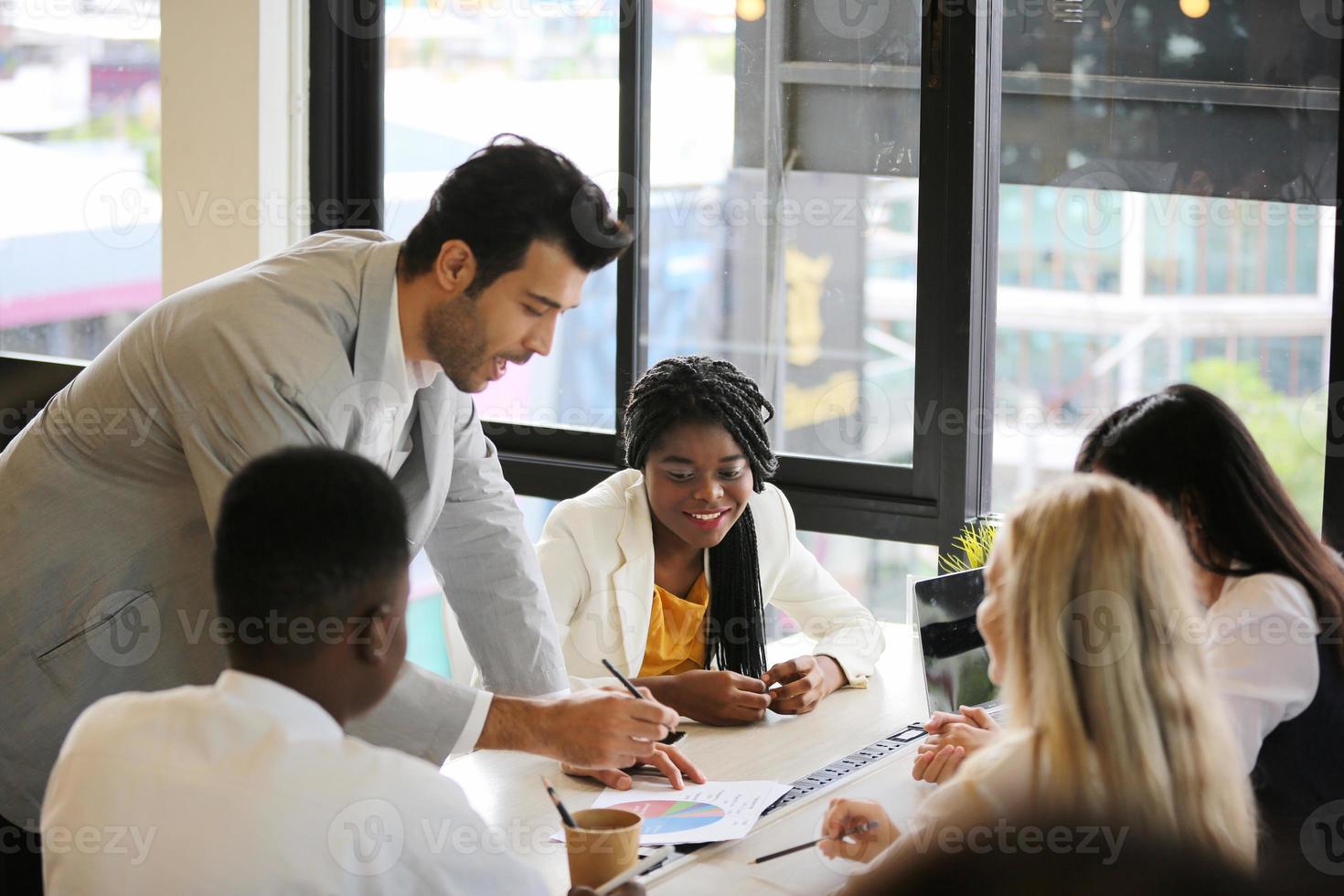 Group of business people collaborating in office or Multiethnic business people in meeting. photo