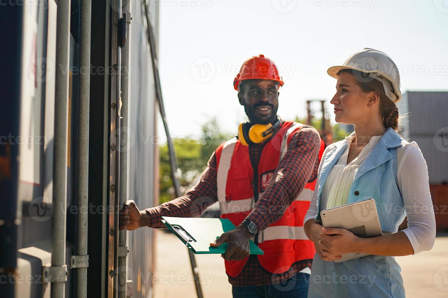 foreman checking containers in the terminal, at import and export business logistic company. photo
