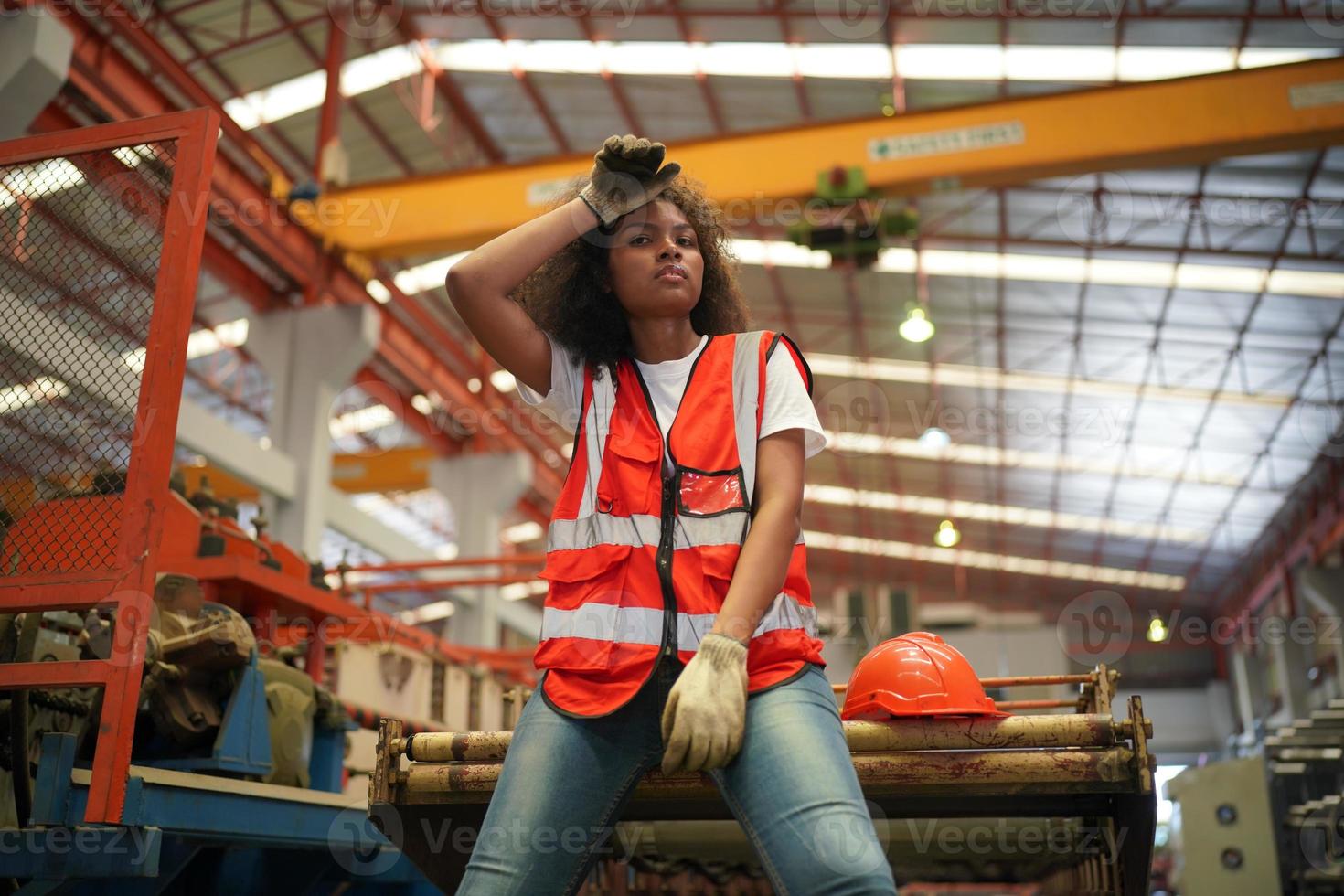 Female worker Foreman or worker work at factory site check up machine or products in site. Engineer or Technician checking Material or Machine on Plant. Industrial and Factory. photo