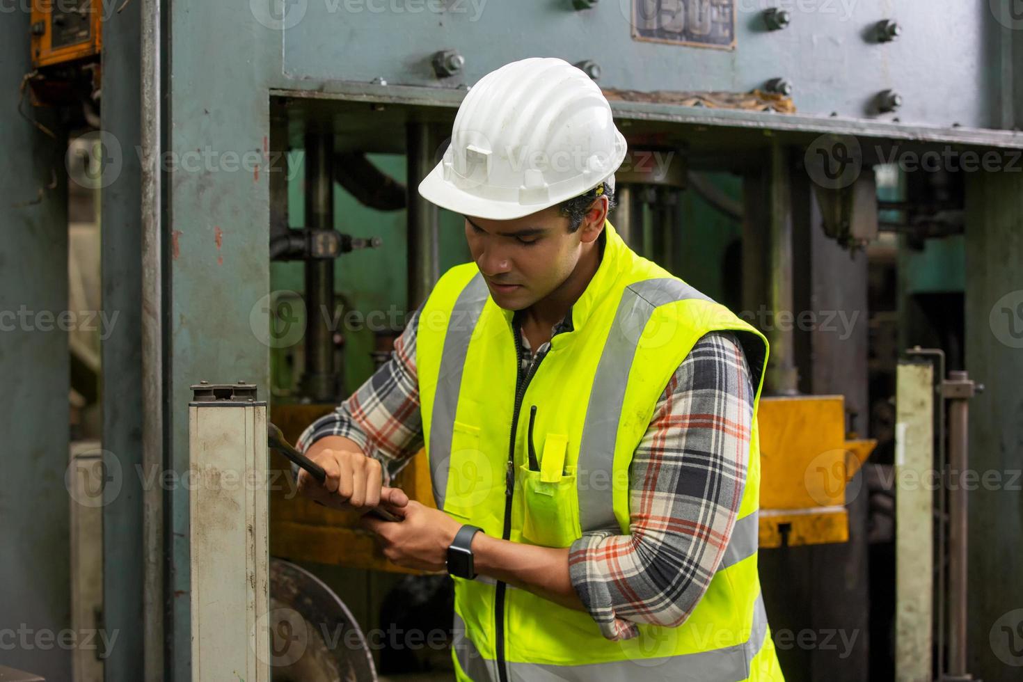 Worker work at factory site check up machine in products line or products in site. Engineer or Technician checking Material or Machine on Plant. Industrial and Factory. photo