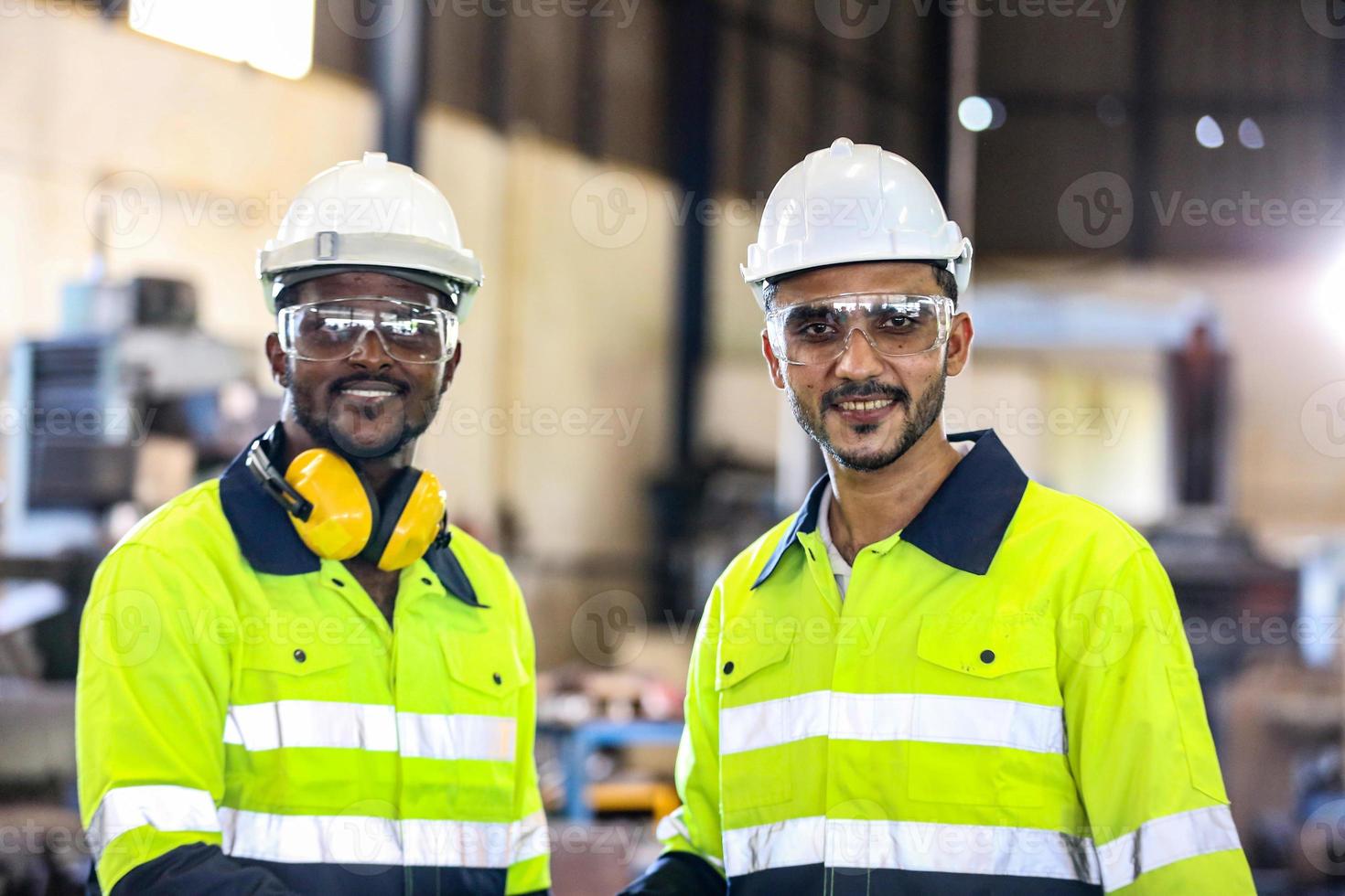 Foreman or worker work at factory site check up machine or products in site. Engineer or Technician checking Material or Machine on Plant. Industrial and Factory. photo