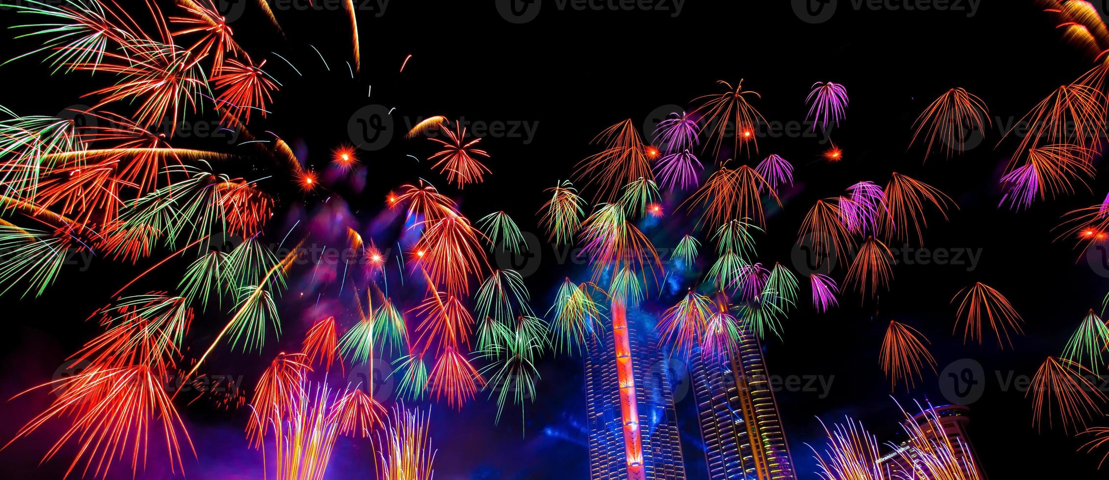 Colorful fireworks in celebrate new year at Chao Phraya river in Bangkok, Thailand. photo