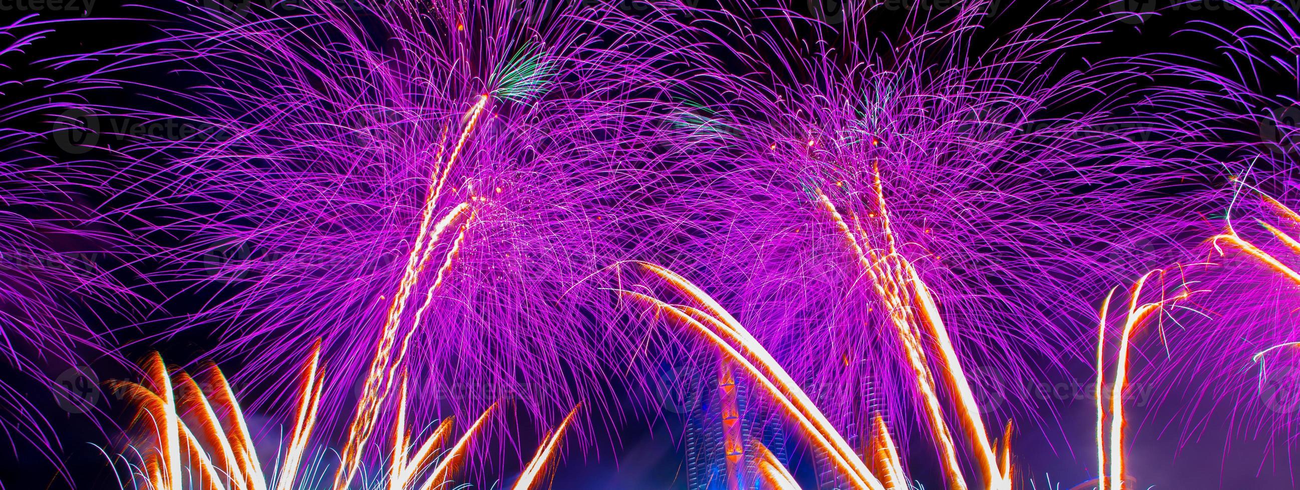 Colorful fireworks in celebrate new year at Chao Phraya river in Bangkok, Thailand. photo